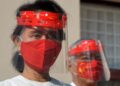 (FILES) In this file photo taken on September 8, 2020 Myanmar’s then civilian leader Aung San Suu Kyi wears a face shield and mask, to prevent the spread of the Covid-19 coronavirus, as she attends an election event in Naypyidaw. – Myanmar’s Aung San Suu Kyi is in quarantine after Covid-19 was detected among her staff, and has skipped three days of hearings for her trial in a junta court, a source with knowledge of the cases said on March 28, 2022. (Photo by Thet Aung / AFP)