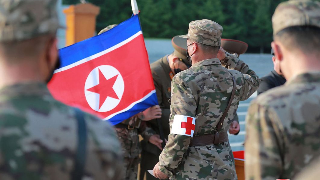 This picture taken on May 16, 2022 and released from North Korea’s official Korean Central News Agency (KCNA) on May 17 shows officers of the military medical field of the Korean People’s Army going to supply medicines to resolve the epidemic prevention crisis over the spread of Covid-19 coronavirus, in Pyongyang. (Photo by KCNA VIA KNS / AFP) / – South Korea OUT /