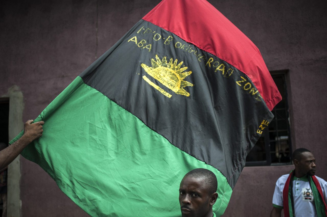 (FILES) In this file photo taken on May 28, 2017 Supporters of the Indigenous People of Biafra (IPOB) wave the Biafra flag (Photo by STEFAN HEUNIS / AFP)