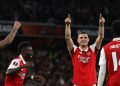 Arsenal’s Swiss midfielder Granit Xhaka (2nd R) celebrates with teammates after scoring the opening goal of the UEFA Europa League Group A football match between Arsenal and PSV Eindhoven at The Arsenal Stadium in London, on October 20, 2022. (Photo by ADRIAN DENNIS / AFP)