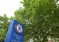 A Chelsea logo is pictured on a sign (Photo by JUSTIN TALLIS / AFP)
