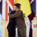 [FILE]This handout picture taken and released by the Ukrainian presidential press service on November 19, 2022, shows Ukrainian President Volodymyr Zelensky (R) and British Prime Minister Rishi Sunak (L) embracing each other after a joint press conference following their meeting in Kyiv, amid Russia’s invasion of Ukraine. – British Prime Minister Rishi Sunak vowed his country would stand by Kyiv’s side “until Ukraine has won” during a meeting with Ukrainian President Volodymyr Zelensky. (Photo by Handout / UKRAINIAN PRESIDENTIAL PRESS SERVICE / AFP) / RESTRICTED