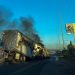 A burning truck is seen across a street during an operation to arrest the son of Joaquin “El Chapo” Guzman, Ovidio Guzman, in Culiacan, Sinaloa state, Mexico, on January 5, 2023. – Intense gunfire rocked a cartel heartland in northwestern Mexico on Thursday after security forces launched an operation in which a son of jailed drug kingpin Joaquin “El Chapo” Guzman was reportedly arrested. (Photo by Marcos Vizcarra / AFP)