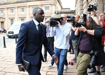 (FILES) In this file photo taken on August 15, 2022 Manchester City and France footballer Benjamin Mendy arrives to Chester Crown Court in northwest England during his trial for a string of sexual offences including rape, attempted rape and sexual assault. – A jury in the UK on January 13, 2023 cleared Mendy of six counts of rape and one of sexual assault against four women, following a six-month trial. (Photo by Paul ELLIS / AFP)
