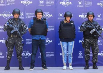 This handout picture released by El Salvador’s National Civil Police shows Colombian Margaret Chacon (2-R), 42, and Salvadoran Wilber Huezo (2-L), 47, after being detained by the National Civil Police in San Salvador on January 18, 2023. – Salvadoran authorities captured Colombian national Margaret Chacon Zuniga on Wednesday for allegedly being involved in the murder of Paraguayan anti-Mafia prosecutor Marcelo Pecci in May 2022 in Colombia, an official source said. Along with her was arrested the Salvadoran Wilber Huezo, whom the authorities claim to have hidden Chacon Zuniga in the country. (Photo by – / NATIONAL CIVIL POLICE / AFP)/