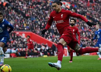 Liverpool’s Uruguayan striker Darwin Nunez runs with the ball during the English Premier League football match between Liverpool and Chelsea at Anfield in Liverpool, north west England on January 21, 2023. (Photo by Paul ELLIS / AFP) / RESTRICTED TO EDITORIAL USE. NO USE WITH UNAUTHORIZED AUDIO, VIDEO, DATA, FIXTURE LISTS, CLUB/LEAGUE LOGOS OR ‘LIVE’ SERVICES. ONLINE IN-MATCH USE LIMITED TO 120 IMAGES. AN ADDITIONAL 40 IMAGES MAY BE USED IN EXTRA TIME. NO VIDEO EMULATION. SOCIAL MEDIA IN-MATCH USE LIMITED TO 120 IMAGES. AN ADDITIONAL 40 IMAGES MAY BE USED IN EXTRA TIME. NO USE IN BETTING PUBLICATIONS, GAMES OR SINGLE CLUB/LEAGUE/PLAYER PUBLICATIONS. – RESTRICTED TO EDITORIAL USE. No use with unauthorized audio, video, data, fixture lists, club/league logos or ‘live’ services. Online in-match use limited to 120 images. An additional 40 images may be used in extra time. No video emulation. Social media in-match use limited to 120 images. An additional 40 images may be used in extra time. No use in betting publications, games or single club/league/player publications. /