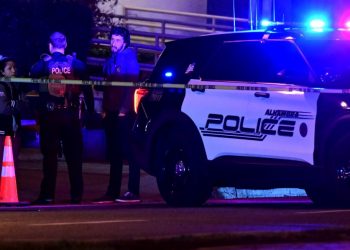 Police patrol the scene along Garvey Avenue in Monterey Park, California, on January 21, 2023, where police are responding to reports of multiple people shot. (Photo by Frederic J. BROWN / AFP)