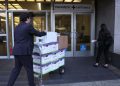 SAN FRANCISCO, CALIFORNIA – JANUARY 17: Legal aides move boxes of material as they arrive for the Elon Musk shareholder lawsuit trial at the Phillip Burton Federal Building on January 17, 2023 in San Francisco, California. Jury selection begins in a lawsuit that has investors suing Tesla and Musk, its chief executive officer, over his August 2018 tweets where he said he was taking Tesla private with funding that he secured. The tweet was found to be false and cost shareholders billions of dollars when Tesla’s stock price began to fluctuate wildly allegedly based on the tweet. Justin Sullivan/Getty Images/AFP (Photo by JUSTIN SULLIVAN / GETTY IMAGES NORTH AMERICA / Getty Images via AFP)