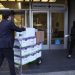SAN FRANCISCO, CALIFORNIA – JANUARY 17: Legal aides move boxes of material as they arrive for the Elon Musk shareholder lawsuit trial at the Phillip Burton Federal Building on January 17, 2023 in San Francisco, California. Jury selection begins in a lawsuit that has investors suing Tesla and Musk, its chief executive officer, over his August 2018 tweets where he said he was taking Tesla private with funding that he secured. The tweet was found to be false and cost shareholders billions of dollars when Tesla’s stock price began to fluctuate wildly allegedly based on the tweet. Justin Sullivan/Getty Images/AFP (Photo by JUSTIN SULLIVAN / GETTY IMAGES NORTH AMERICA / Getty Images via AFP)