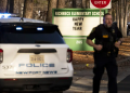 A police officer runs in front of a police patrol car at Richneck Elementary School, Newport News, Virginia. Photo: Sunday World