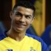Portugal’s forward Cristiano Ronaldo poses with Al-Nassr’s number seven jersey in Madrid on December 30, 2022 upon signing for the Saudi Arabian club.