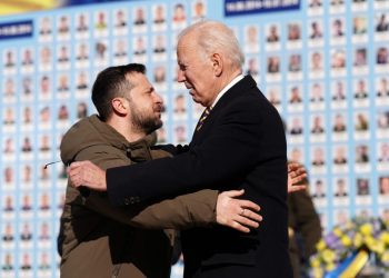 US President Joe Biden (R) is greeted by Ukrainian President Volodymyr Zelensky (L) during a visit in Kyiv on February 20, 2023. – US President Joe Biden made a surprise trip to Kyiv on February 20, 2023, ahead of the first anniversary of Russia’s invasion of Ukraine, AFP journalists saw. Biden met Ukrainian President Volodymyr Zelensky in the Ukrainian capital on his first visit to the country since the start of the conflict. (Photo by Dimitar DILKOFF / AFP)