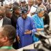 All Progressives Congress (APC) presidential candidate Bola Tinubu (C) arrives to vote at a polling station in Lagos on February 25, 2023, during Nigeria’s presidential and general election. (Photo by John Wessels / AFP)