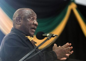 South Africa President Cyril Ramaphosa addresses delegates at the Olive Convention Centre in Durban, on July 24, 2022. – The 9th annual Kwazlu-Natal Provincial conference elected pro Zuma leaders, which is seen as a setback for South African President Cyril Ramaphosa. Protesters sang and chanted slogans calling for the resignation of the South African President Cyril Ramaphosa who is due to address the 1,700 delegates at the closing of the conference. (Photo by Rajesh JANTILAL / AFP)