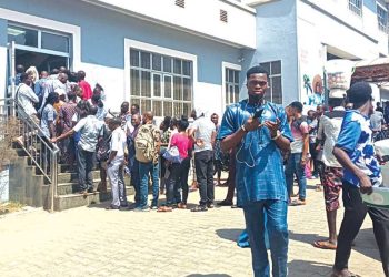 Residents of the Federal Capital Territory (FCT) at a bank in Abuja…yesterday. PHOTO: PHILIP OJISUA