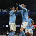 Manchester City’s Algerian midfielder Riyad Mahrez (centre left) celebrates with Manchester City’s Norwegian striker Erling Haaland (centre right) after scoring their third goal from the penalty spot during the English Premier League football match between Manchester City and Aston Villa at the Etihad Stadium in Manchester, north west England, on February 12, 2023. (Photo by Paul ELLIS / AFP).
