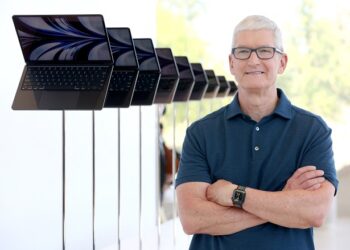 CUPERTINO, CALIFORNIA - JUNE 06: Apple CEO Tim Cook stands next to a display of newly redesigned MacBook Air laptop during the WWDC22 at Apple Park on June 06, 2022 in Cupertino, California. Apple CEO Tim Cook kicked off the annual WWDC22 developer conference.   Justin Sullivan/Getty Images/AFP (Photo by JUSTIN SULLIVAN / GETTY IMAGES NORTH AMERICA / Getty Images via AFP)