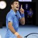 Serbia’s Novak Djokovic reacts as he competes against Bulgaria’s Grigor Dimitrov during their men’s singles match on day six of the Australian Open tennis tournament in Melbourne on January 21, 2023. (Photo by Martin KEEP / AFP) / — IMAGE RESTRICTED TO EDITORIAL USE – STRICTLY NO COMMERCIAL USE — – — IMAGE RESTRICTED TO EDITORIAL USE – STRICTLY NO COMMERCIAL USE —