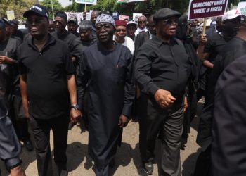 Candidate of Nigeriaís Peopleís Democratic Party, Atiku Abubakar (2nd L) leads supporters to protest at Independent National Electoral Commission (INEC) headquarters, over the results of Nigeriaís 2023 presidential and general election in Abuja on March 6, 2023. (Photo by KOLA SULAIMON / AFP)