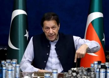 This screengrab from Pakistan Tehreek-e-Insaf via AFPTV taken on March 15, 2023 shows former Pakistan prime minister Imran Khan issuing a video statement with a display of spent teargas canisters that he claims were fired into his home in Lahore. – Pakistan police appeared on Match 15 to have given up an attempt to arrest Khan, ending a siege of his residence after violent clashes with hundreds of his supporters. (Photo by – / AFP/ Pakistan Tehreek-e-Insaf via AFPTV / AFP)