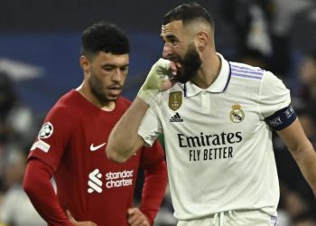 Real Madrid’s French forward Karim Benzema during reacts to hurting himself celebrating his goal the UEFA Champions League last 16 second leg football match between Real Madrid CF and Liverpool FC at the Santiago Bernabeu stadium in Madrid on March 15, 2023. (Photo by JAVIER SORIANO / AFP)