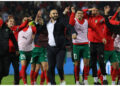 Morocco’s coach Walid Regragui (C) and his players greet the fans after the friendly football match between Morocco and Brazil at the Ibn Batouta Stadium in Tangier on March 26, 2023. (Photo by Fadel Senna / AFP)