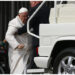 Pope Francis is helped get up the popemobile car as he leaves on March 29, 2023 at the end of the weekly general audience at St. Peter’s square in The Vatican. Pope Francis has been at the Gemelli Hospital in Rome since the afternoon of March 29, 2023 for some previously scheduled check-ups, the Holy See press director said. (Photo by Vincenzo PINTO / AFP)
