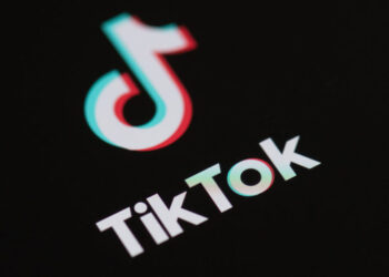 (FILES) In this file photo taken on May 27, 2020 (FILES) This file illustration photo taken on May 27, 2020 This illustration picture shows the logo of the social network application Tik Tok on the screen of a phone. – President Donald Trump is days away from announcing strong action against the popular Chinese-owned video-sharing app TikTok to protect US national security, Secretary of State Mike Pompeo said August 2, 2020. (Photo by Martin BUREAU / AFP)