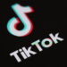 (FILES) In this file photo taken on May 27, 2020 (FILES) This file illustration photo taken on May 27, 2020 This illustration picture shows the logo of the social network application Tik Tok on the screen of a phone. – President Donald Trump is days away from announcing strong action against the popular Chinese-owned video-sharing app TikTok to protect US national security, Secretary of State Mike Pompeo said August 2, 2020. (Photo by Martin BUREAU / AFP)