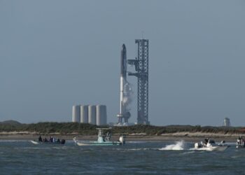 The SpaceX Starship rocket stands on the launchpad from the SpaceX Starbase in Boca Chica as seen from South Padre Island, Texas on April 17, 2023. – SpaceX on Monday postponed the first test flight of Starship, the most powerful rocket ever built.Liftoff of the giant rocket was called off just minutes ahead of the scheduled launch time because of a pressurization issue, SpaceX officials said. (Photo by Patrick T. Fallon / AFP)