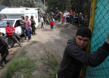 Relatives of miners trapped inside a coal mine wait for news in Cucunuba, Colombia, on April 20, 2023. – Three people were killed and four others are missing in a coal mine in central Colombia after an explosion in two interconnected shafts, authorities said Thursday. (Photo by Juan Pablo Pino / AFP)