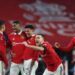Manchester United’s Austrian midfielder Marcel Sabitzer (L), Manchester United’s Brazilian midfielder Casemiro (2L), Manchester United’s English striker Marcus Rashford (3L), Manchester United’s English striker Jadon Sancho (C), Manchester United’s Portuguese defender Diogo Dalot (3R) and Manchester United’s Brazilian midfielder Fred (R) celebrate after winning a penalty shoot out during the English FA Cup semi-final football match between Manchester United and Brighton and Hove Albion at Wembley Stadium in north west London on April 23, 2023. – Manchester United won after extra time and a penalty shoot out. (Photo by Adrian DENNIS / AFP) / NOT FOR MARKETING OR ADVERTISING USE / RESTRICTED TO EDITORIAL USE – NOT FOR MARKETING OR ADVERTISING USE / RESTRICTED TO EDITORIAL USE