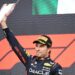Red Bull Racing’s Mexican driver Sergio Perez celebrates with the trophy after winning the Formula One Azerbaijan Grand Prix at the Baku City Circuit in Baku on April 30, 2023. (Photo by NATALIA KOLESNIKOVA / AFP)