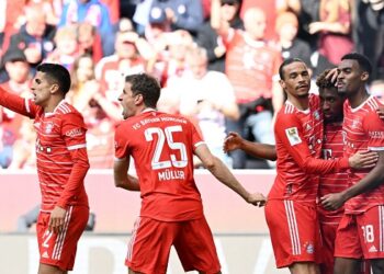 Bayern Munich's French forward Kingsley Coman (2nd R) celebrates scoring the 2-0 goal with his team-mates Bayern Munich's German midfielder Leroy Sane (C), Bayern Munich's Dutch midfielder Ryan Gravenberch (R) Bayern Munich's German forward Thomas Mueller and Bayern Munich's Portuguese defender Joao Cancelo (L) during the German first division Bundesliga football match between FC Bayern Munich and Hertha Berlin in Munich, southern Germany on April 30, 2023. (Photo by Christof STACHE / AFP) / DFL REGULATIONS PROHIBIT ANY USE OF PHOTOGRAPHS AS IMAGE SEQUENCES AND/OR QUASI-VIDEO  - DFL REGULATIONS PROHIBIT ANY USE OF PHOTOGRAPHS AS IMAGE SEQUENCES AND/OR QUASI-VIDEO