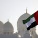 The flag of United Arab Emirates flies at half-mast outside the Sheikh Zayed Grand Mosque in Abu Dhabi on May 13, 2022, following the death of UAE’s President Sheikh Khalifa bin Zayed Al-Nahyan. – UAE’s President Sheikh Khalifa bin Zayed Al-Nahyan died aged 73 after a years-long battle with illness, triggering a period of mourning and a handover of power in the oil-rich Gulf state. (Photo by Karim SAHIB / AFP)