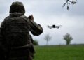 A Ukrainian serviceman of a reconnaissance team flyes a drone at a front line near the town of Bakhmut, Donetsk region on May 8, 2023, amid the Russian invasion of Ukraine. (Photo by Sergey SHESTAK / AFP)