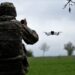 A Ukrainian serviceman of a reconnaissance team flyes a drone at a front line near the town of Bakhmut, Donetsk region on May 8, 2023, amid the Russian invasion of Ukraine. (Photo by Sergey SHESTAK / AFP)