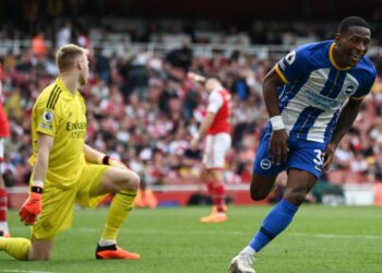 Brighton’s Ecuadrorian defender Pervis Estupinan celebrates after scoring his team third goal during the English Premier League football match between Arsenal and Brighton and Hove Albion at the Emirates Stadium in London on May 14, 2023. (Photo by Glyn KIRK / AFP)