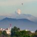The Nevado del Ruiz volcano emits a cloud of ash as seen from Bogota, on May 18, 2023. – The 5,300-metre (17,400-foot) colossus in western Colombia is one of the many volcanoes along the Ring of Fire, a path around the Pacific basin characterized by active volcanoes and frequent earthquakes. The rumbling, notorious volcano has been showing increased seismic activity in the past weeks. (Photo by Guillermo MUNOZ / AFP)