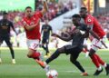 Nottingham Forest’s French defender Moussa Niakhate (R) vies with Arsenal’s English midfielder Bukayo Saka during the English Premier League football match between Nottingham Forest and Arsenal at The City Ground in Nottingham, central England, on May 20, 2023. (Photo by Darren Staples / AFP)