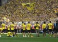 Dortmund players go to their fans after the German first division Bundesliga football match between Borussia Dortmund and 1 FSV Mainz 05 in Dortmund, western Germany on May 27, 2023. (Photo by INA FASSBENDER / AFP)