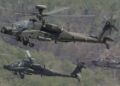 An AH64 Apachi longboe helicopters hovers Photo: Chung Sung-Jun/Getty Images