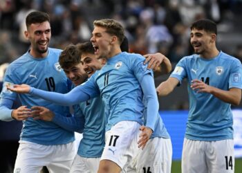 Israel’s forward Omer Senior (C) celebrates with teammates after scoring a goal during the Argentina 2023 U-20 World Cup third-place match between Israel and South Korea at the Estadio Unico Diego Armando Maradona stadium in La Plata, Argentina, on June 11, 2023. (Photo by Luis ROBAYO / AFP)