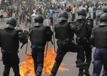 Congolese riot police retreat as a Molotov cocktail explodes infront of them on the outskirts of Kinshasa, Democratic Republic of Congo, Tuesday 25 July 2006. Thousands of Congolese rioted Tuesday throwing rocks and Molotov cocktails at police calling for a boycott of the elections saying they will not be free and fair. The DRC holds its first democratic presidential elections in more than 40 years on July 30. Opposition parties warn of bloodshed if the elections go ahead without addressing various concerns about vote-rigging. EPA/NIC BOTHMA