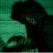 A man holds a laptop computer as cyber code is projected on him in this illustration picture taken on May 13, 2017. REUTERS/Kacper Pempel/Illustration/File Photo