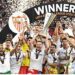 Sevilla's players celebrate with the trophy after winning the UEFA Europa League final football match between Sevilla FC and AS Roma at the Puskas Arena in Budapest, Hungary on May 31, 2023. (Photo by Attila KISBENEDEK / AFP)