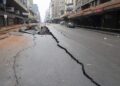 A general view of a damaged road in Johannesburg on July 20, 2023, following an unexplained explosion which occurred during rush hour on July 19, 2023. – A body of a man was found in Johannesburg in the early hours of July 20, 2023 after an unexplained explosion ripped through the city centre tearing through a main road and injuring 41 people, officials said. (Photo by Luca Sola / AFP)