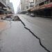 A general view of a damaged road in Johannesburg on July 20, 2023, following an unexplained explosion which occurred during rush hour on July 19, 2023. – A body of a man was found in Johannesburg in the early hours of July 20, 2023 after an unexplained explosion ripped through the city centre tearing through a main road and injuring 41 people, officials said. (Photo by Luca Sola / AFP)