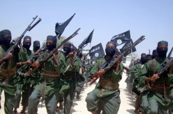 FILE - Al-Shabab fighters march with their weapons during military exercises on the outskirts of Mogadishu, Somalia, Feb. 17, 2011. The U.S. military said, July 9, 2023, it has conducted three new airstrikes against al-Shabab fighters in the Lower Juba region.