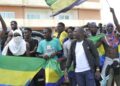 Residents holding Gabon national flags celebrate in Libreville on August 30, 2023 after a group of Gabonese military officers appeared on television announcing they were “putting an end to the current regime” and scrapping official election results that had handed another term to veteran President Ali Bongo Ondimba. –  (Photo by – / AFP)